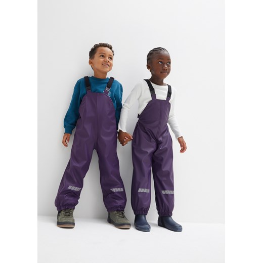 Spodnie dziecięce przeciwdeszczowe na szelkach, ocieplane ze sklepu bonprix w kategorii Spodnie dziewczęce - zdjęcie 170606444