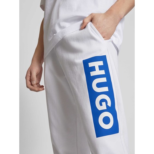 Spodnie dresowe o kroju regular fit z nadrukiem z logo model ‘Nuram’ Hugo Blue M Peek&Cloppenburg 