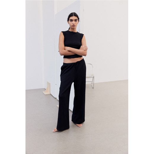 H & M - Dżersejowe spodnie w strukturalny splot - Czarny ze sklepu H&M w kategorii Spodnie damskie - zdjęcie 170636254