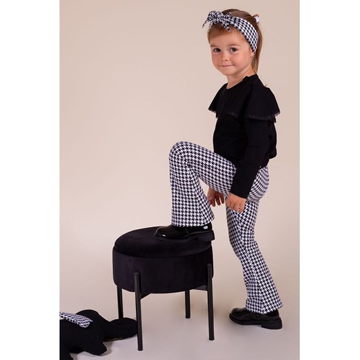 Bawełniane spodnie dresowe dzwony biało-czarne w pepitkę dla dziewczynki 116 promocyjna cena 5.10.15