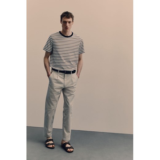 H & M - Bawełniane spodnie chinos Regular Fit - Beżowy H & M 38 H&M