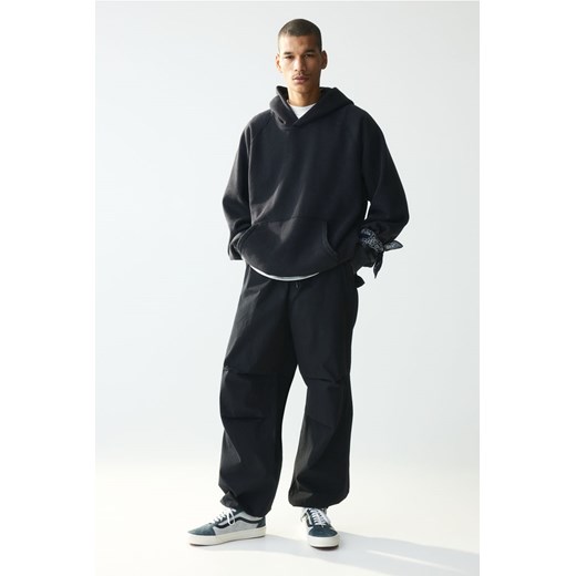 H & M - Spodnie spadochronowe Loose Fit - Czarny ze sklepu H&M w kategorii Spodnie męskie - zdjęcie 170809930