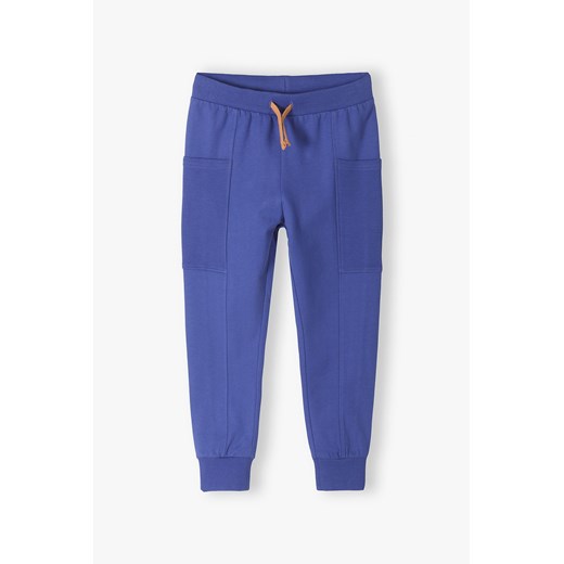 Bawełniane dresowe spodnie dla chłopca regular fit - niebieskie ze sklepu 5.10.15 w kategorii Spodnie chłopięce - zdjęcie 170888702