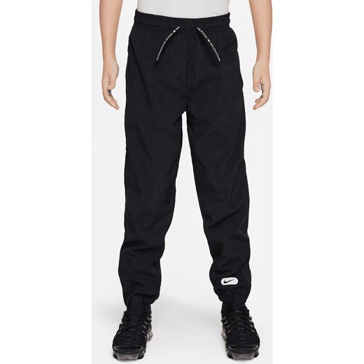 Spodnie dla dużych dzieci (chłopców) Repel Nike Athletics - Czerń ze sklepu Nike poland w kategorii Spodnie chłopięce - zdjęcie 170947471