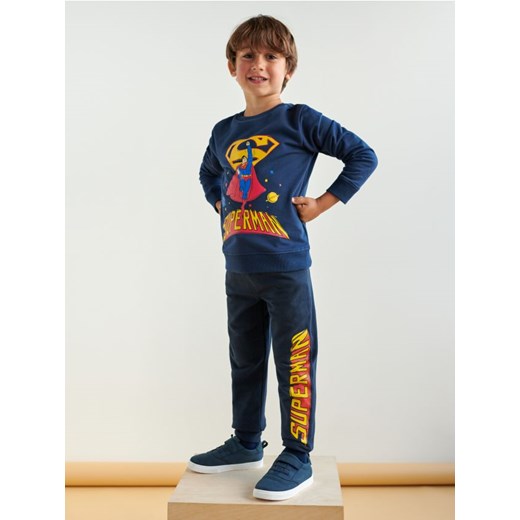 Sinsay - Spodnie dresowe jogger Superman - granatowy Sinsay 116 Sinsay