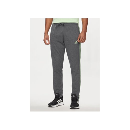adidas Spodnie dresowe Essentials IS1367 Szary Regular Fit ze sklepu MODIVO w kategorii Spodnie męskie - zdjęcie 171253984