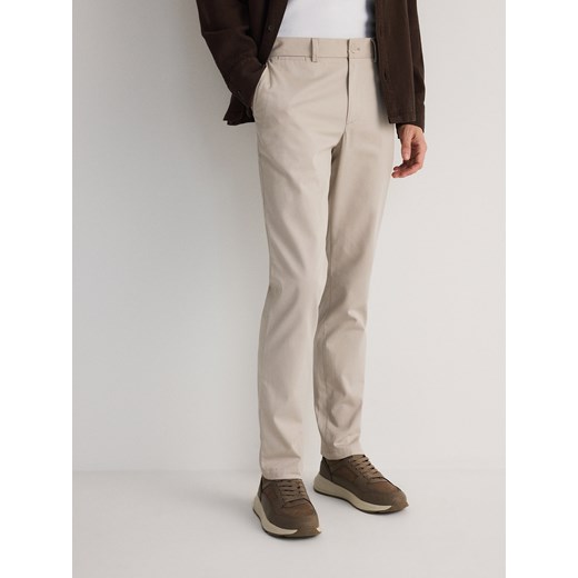 Reserved - Spodnie chino slim fit - beżowy Reserved 30 Reserved
