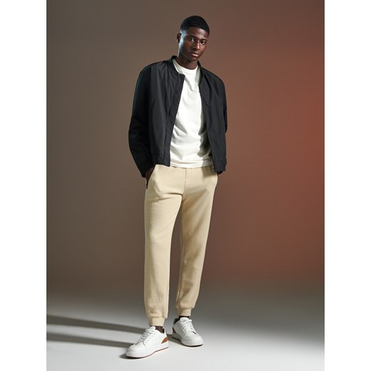 Sinsay - Spodnie dresowe - kremowy Sinsay L Sinsay