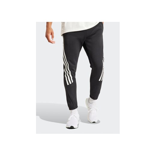 adidas Spodnie dresowe Future Icons 3-Stripes IN3310 Czarny Slim Fit ze sklepu MODIVO w kategorii Spodnie męskie - zdjęcie 171344292