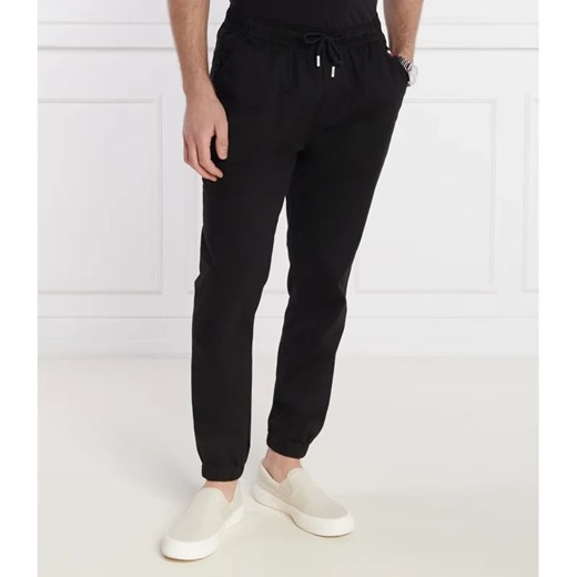 Tommy Jeans Spodnie jogger AUSTIN | Regular Fit ze sklepu Gomez Fashion Store w kategorii Spodnie męskie - zdjęcie 171359912