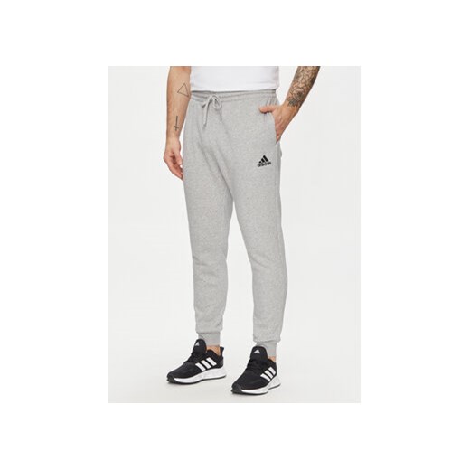adidas Spodnie dresowe Essentials Fleece HL2230 Szary Regular Fit ze sklepu MODIVO w kategorii Spodnie męskie - zdjęcie 171412954