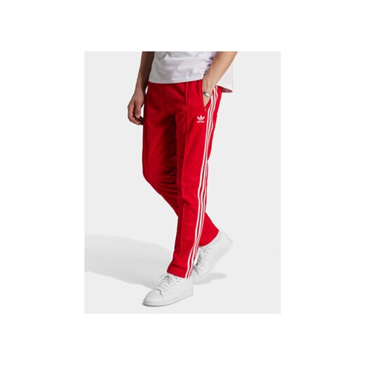 adidas Spodnie dresowe adicolor Classics Beckenbauer IM4547 Czerwony Slim Fit ze sklepu MODIVO w kategorii Spodnie męskie - zdjęcie 171449102