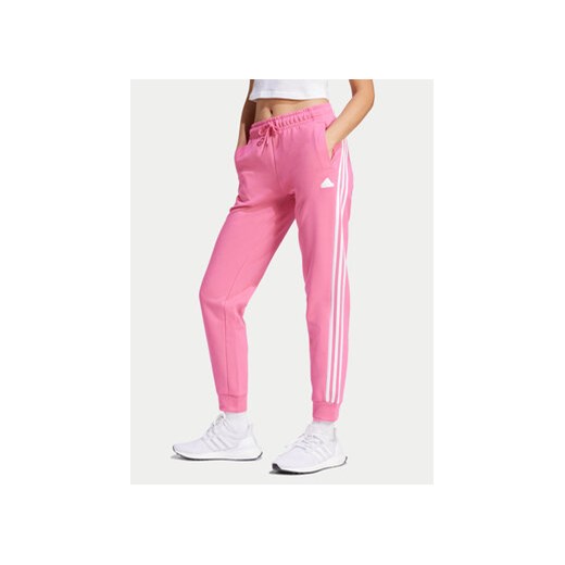 adidas Spodnie dresowe Future Icons 3-Stripes IS3942 Różowy Regular Fit ze sklepu MODIVO w kategorii Spodnie damskie - zdjęcie 171507964