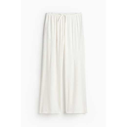 Spodnie damskie białe H & M z tkaniny na wiosnę 
