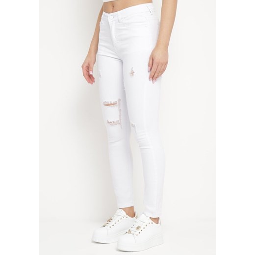 Białe Jeansy Skinny z Przetarciami i Dziurami Qloelini ze sklepu Born2be Odzież w kategorii Jeansy damskie - zdjęcie 172047131
