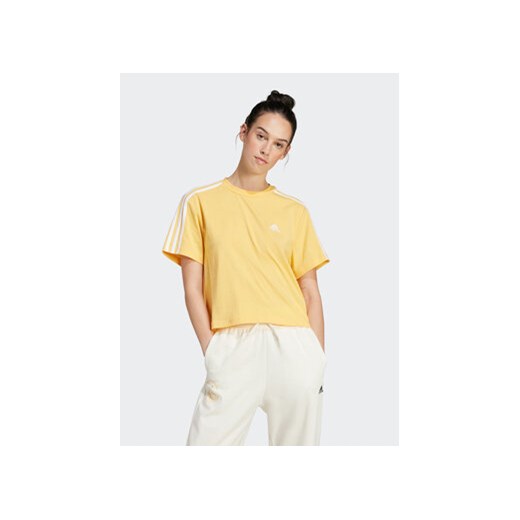 adidas T-Shirt Essentials 3-Stripes IS1575 Żółty Loose Fit ze sklepu MODIVO w kategorii Bluzki damskie - zdjęcie 172104552