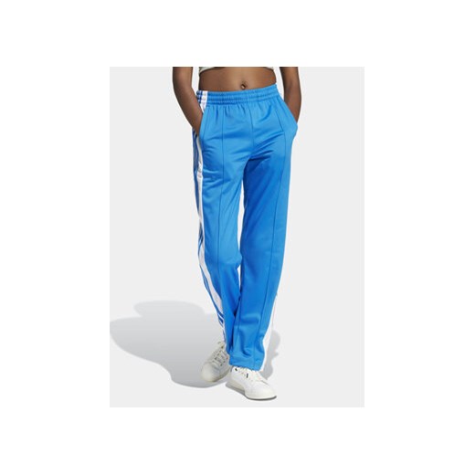 adidas Spodnie dresowe Adibreak IP0615 Niebieski Regular Fit ze sklepu MODIVO w kategorii Spodnie damskie - zdjęcie 172104772