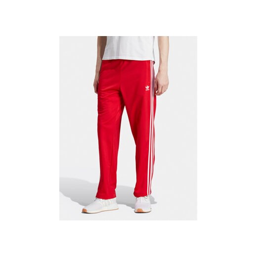 adidas Spodnie dresowe adicolor Classics Firebird IJ7057 Czerwony Regular Fit ze sklepu MODIVO w kategorii Spodnie męskie - zdjęcie 172178154