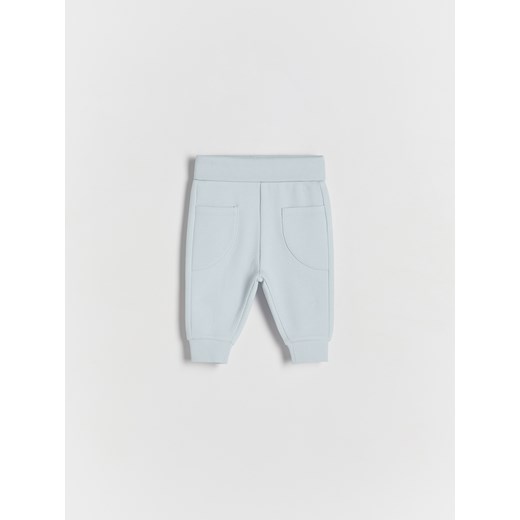 Reserved - Dzianinowe spodnie z kieszeniami - jasnoniebieski ze sklepu Reserved w kategorii Spodnie i półśpiochy - zdjęcie 172189882