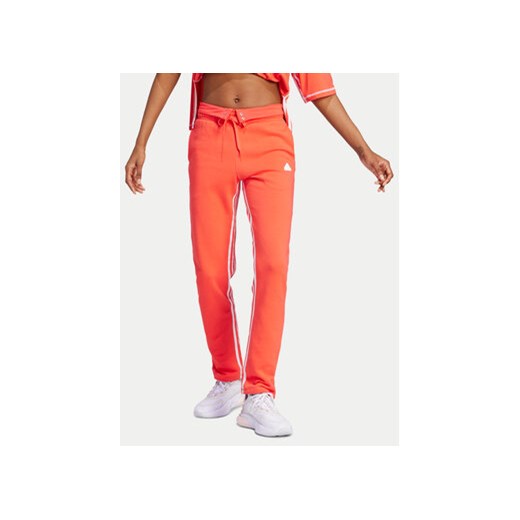 adidas Spodnie dresowe Dance All-Gender Versatile IS0897 Pomarańczowy Regular Fit ze sklepu MODIVO w kategorii Spodnie damskie - zdjęcie 172247932