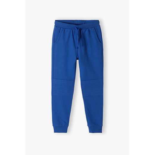 Spodnie dresowe dla chłopca - niebieskie - slim - Lincoln&Sharks ze sklepu 5.10.15 w kategorii Spodnie chłopięce - zdjęcie 172338303