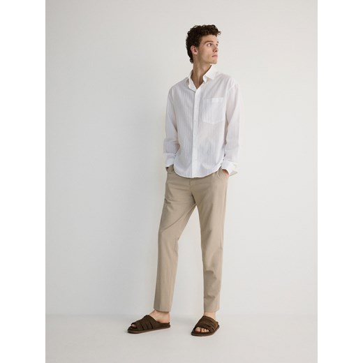Reserved - Spodnie slim fit - beżowy ze sklepu Reserved w kategorii Spodnie męskie - zdjęcie 172352903