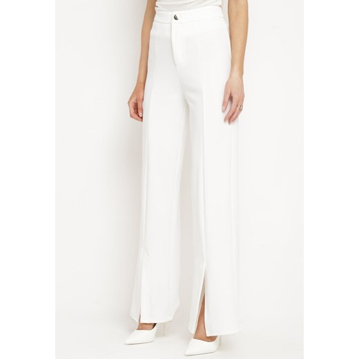 Białe Szerokie Spodnie z Wysokim Stanem i Wiskozą Ozdobione na Dole Rozcięciami Xolea ze sklepu Born2be Odzież w kategorii Spodnie damskie - zdjęcie 172386524