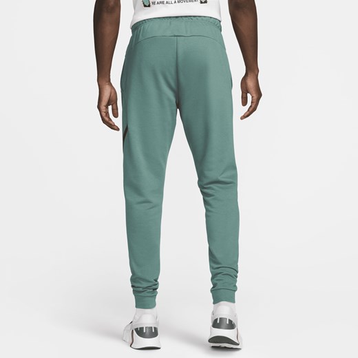 Męskie zwężane spodnie do fitnessu Dri-FIT Nike Dry Graphic - Zieleń Nike M Nike poland