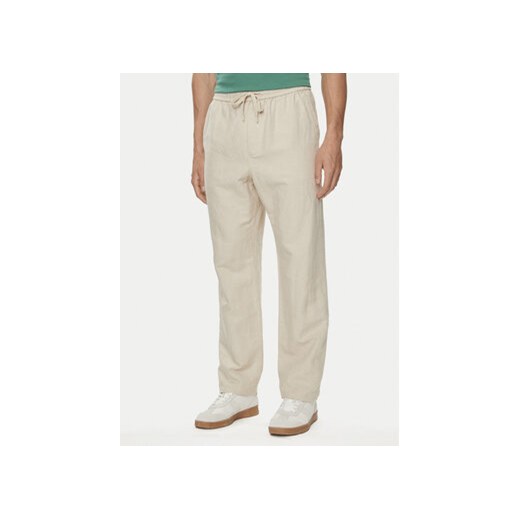 Gap Spodnie materiałowe 870590-01 Beżowy Regular Fit ze sklepu MODIVO w kategorii Spodnie męskie - zdjęcie 172637410