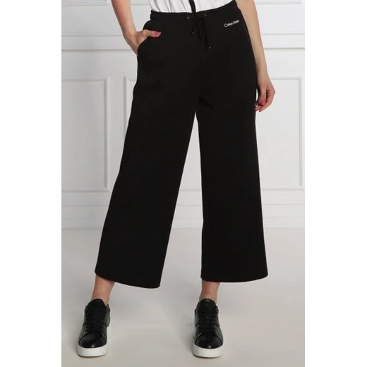 Calvin Klein Spodnie dresowe | flare fit ze sklepu Gomez Fashion Store w kategorii Spodnie damskie - zdjęcie 172941534