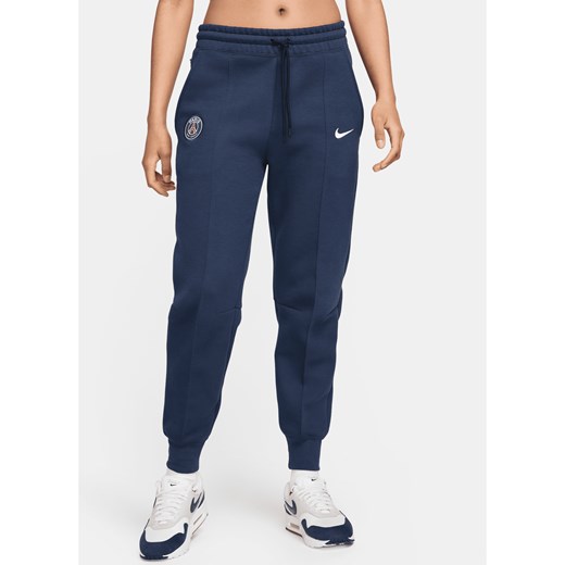 Damskie joggery piłkarskie ze średnim stanem Nike Paris Saint-Germain Tech Fleece - Niebieski ze sklepu Nike poland w kategorii Spodnie damskie - zdjęcie 173311224