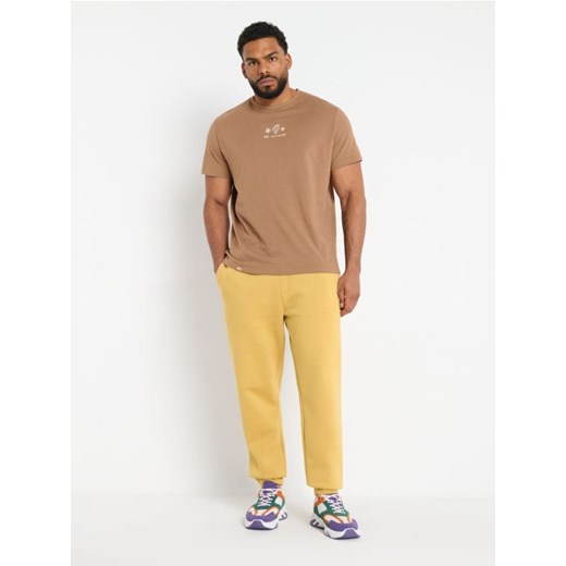 Sinsay - Spodnie dresowe jogger - żółty ze sklepu Sinsay w kategorii Spodnie męskie - zdjęcie 173391110
