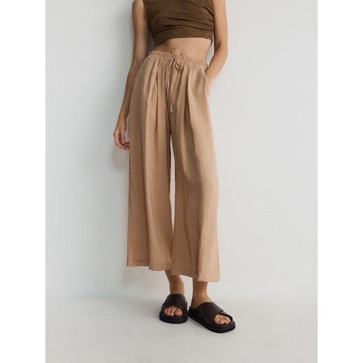 Reserved - Spodnie culotte z modalu - brzoskwiniowy ze sklepu Reserved w kategorii Spodnie damskie - zdjęcie 173589994