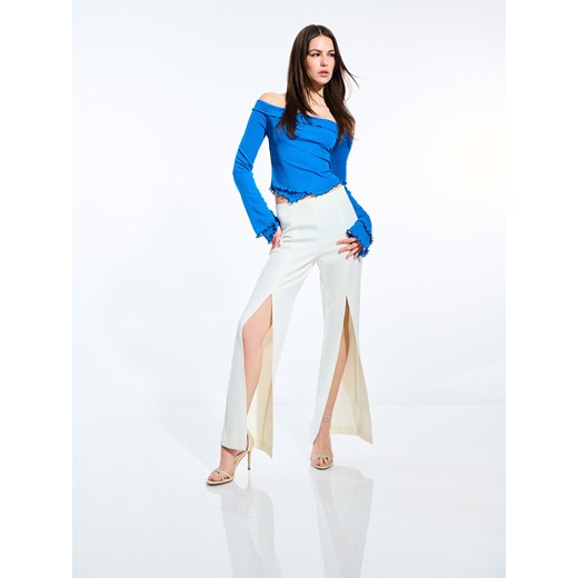 Mohito - Spodnie z rozcięciami - biały ze sklepu Mohito w kategorii Spodnie damskie - zdjęcie 173599023