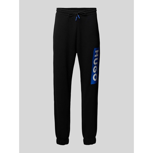 Spodnie dresowe o kroju regular fit z nadrukiem z logo model ‘Nuram’ ze sklepu Peek&Cloppenburg  w kategorii Spodnie męskie - zdjęcie 173604030