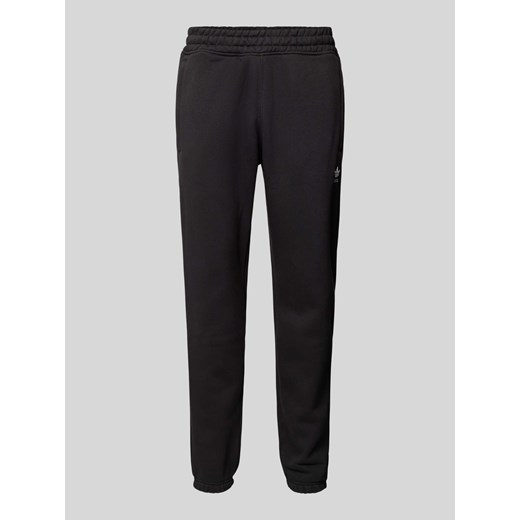 Spodnie dresowe o kroju tapered fit z wyhaftowanym logo ze sklepu Peek&Cloppenburg  w kategorii Spodnie męskie - zdjęcie 173999273