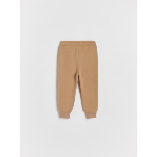 Reserved - Dresowe spodnie - brązowy Reserved 98 (2-3 lata) Reserved