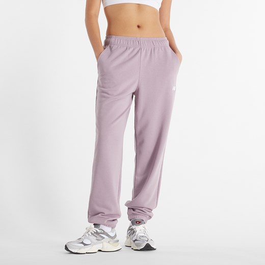 Spodnie damskie New Balance WP41500ICW – różowe ze sklepu New Balance Poland w kategorii Spodnie damskie - zdjęcie 174575861