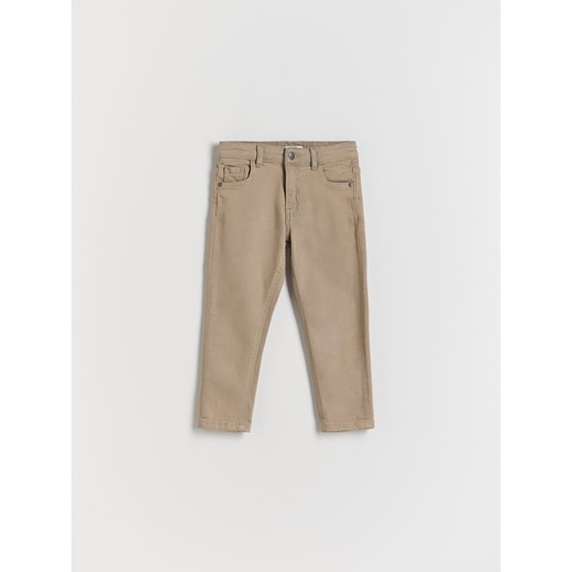 Reserved - Elastyczne jeansy slim - beżowy ze sklepu Reserved w kategorii Spodnie chłopięce - zdjęcie 174803924