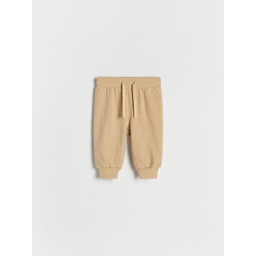 Reserved - Bawełniane spodnie - beżowy ze sklepu Reserved w kategorii Spodnie i półśpiochy - zdjęcie 174827841