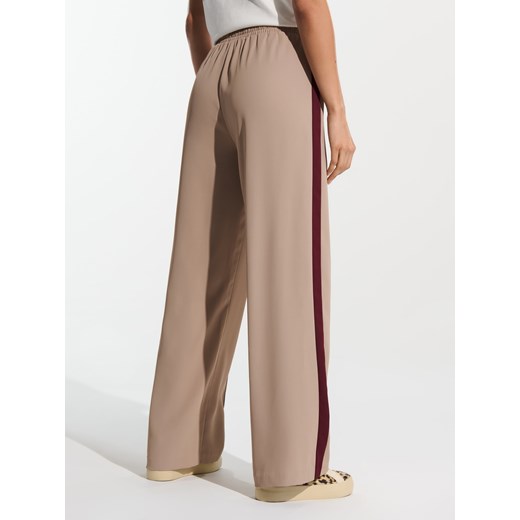 Beżowe spodnie damskie Sinsay wiosenne 