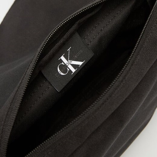 CALVIN KLEIN TOREBKA SPORT ESSENTIALS FL CAMERA BAG M Calvin Klein ONE SIZE Symbiosis