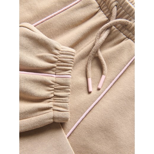 Reserved - Spodnie dresowe z przeszyciami - beżowy Reserved 98 (2-3 lata) Reserved