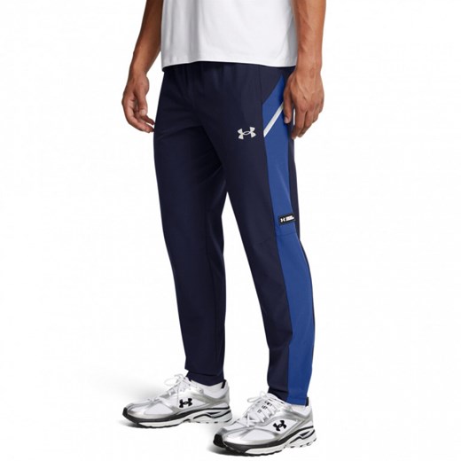 Męskie spodnie treningowe Under Armour UA Woven Utility Pants -granatowe ze sklepu Sportstylestory.com w kategorii Spodnie męskie - zdjęcie 175535182
