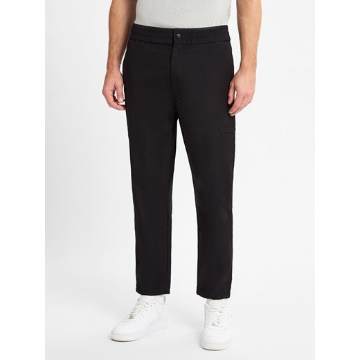 Calvin Klein Jeans Spodnie Mężczyźni Sztuczne włókno czarny jednolity ze sklepu vangraaf w kategorii Spodnie męskie - zdjęcie 175539804