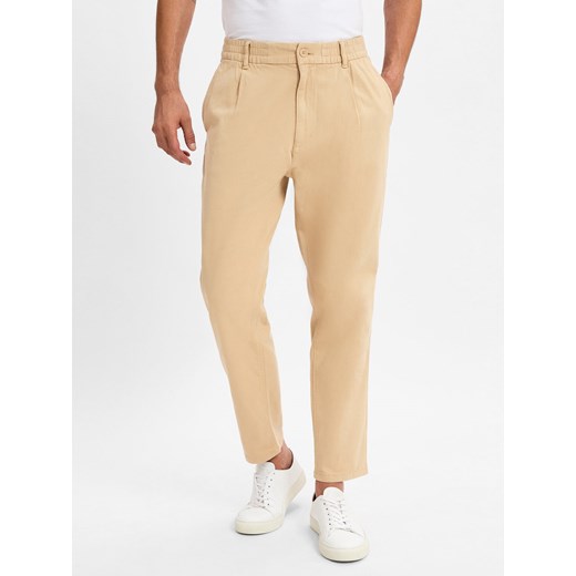 Tommy Jeans Spodnie materiałowe Mężczyźni Bawełna wielbłądzi jednolity ze sklepu vangraaf w kategorii Spodnie męskie - zdjęcie 175547032