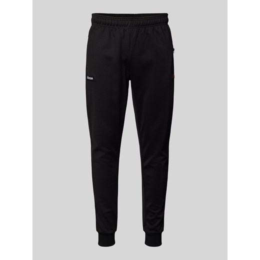 Spodnie typu track pants o kroju tapered fit z naszywkami z logo model ‘BERTONI’ ze sklepu Peek&Cloppenburg  w kategorii Spodnie męskie - zdjęcie 175809234