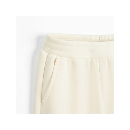 COOL CLUB Spodnie dresowe w kolorze kremowym Cool Club 116 okazyjna cena Limango Polska