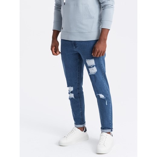 Washowane spodnie męskie jeansowe TAPERED FIT z przetarciami – niebieskie V2 OM-PADP-0163 ze sklepu ombre w kategorii Jeansy męskie - zdjęcie 176301224
