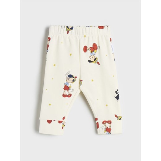 Sinsay - Legginsy Disney - kremowy Sinsay 62 Sinsay